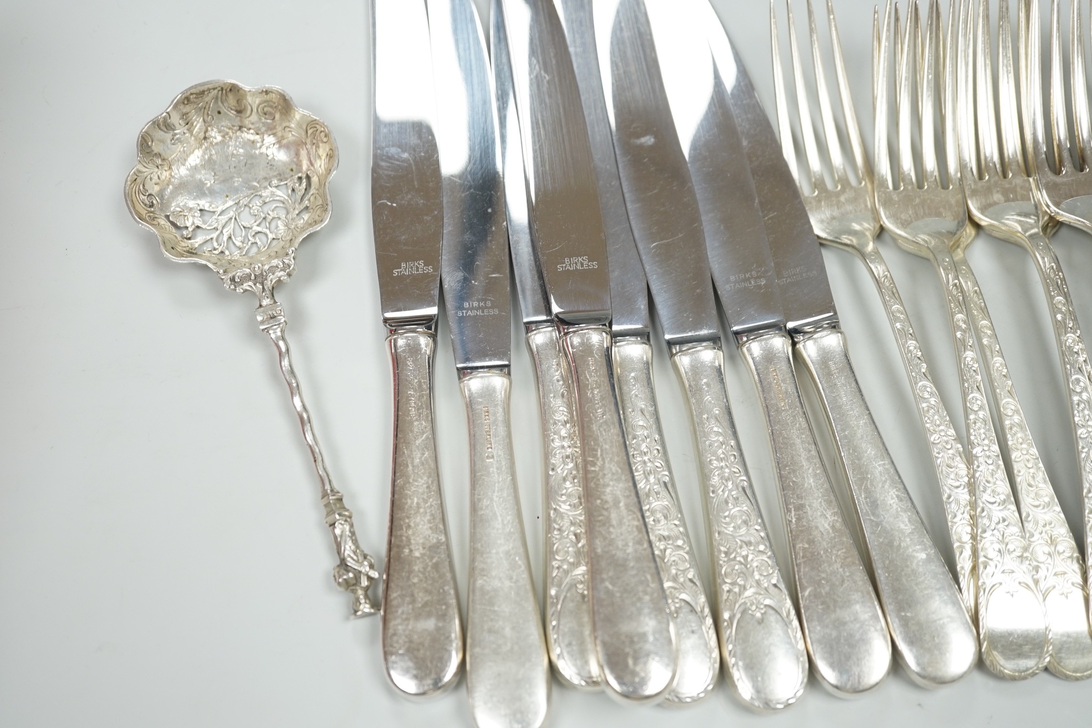 Five Canadian Birks sterling table forks, one sterling teaspoon and six sterling handled table knives, together with seven items of sterling flatware, a Hanau white metal ornate spoon and fifteen items of Birks Regency p